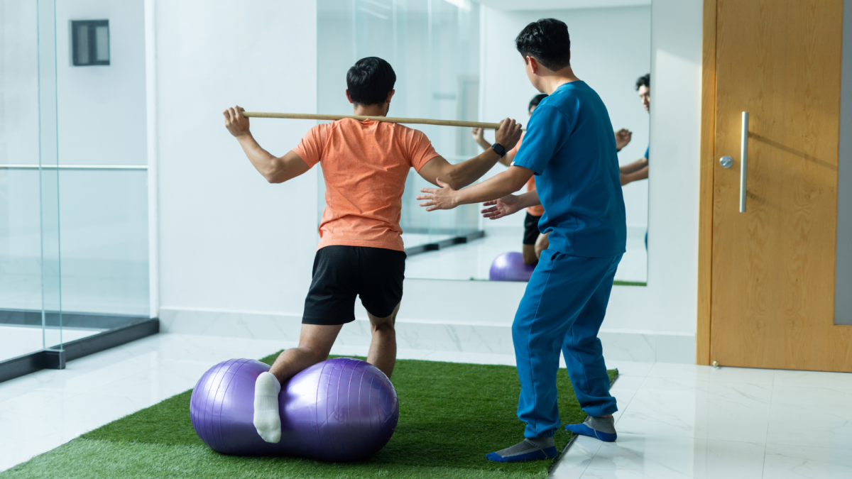physical therapist assisting with mobility exercises