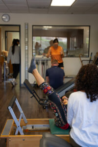 Physical therapist treating patients in clinic